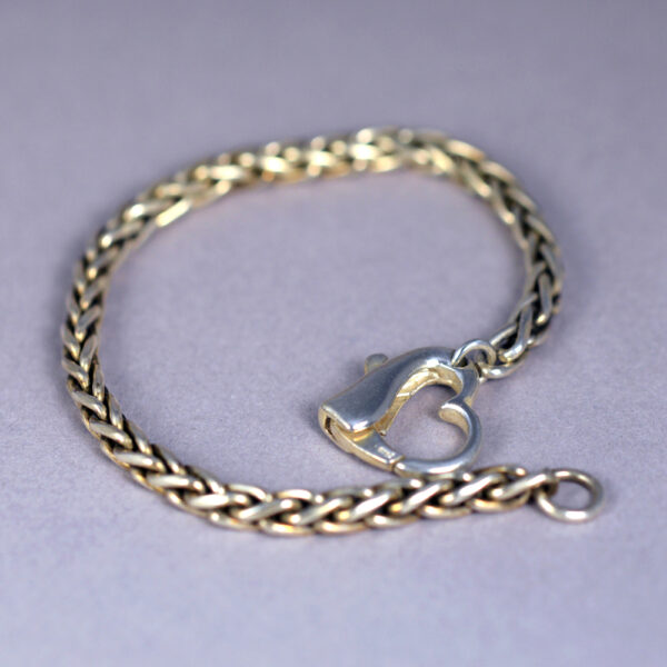 A silver chain bracelet with an anchor charm.