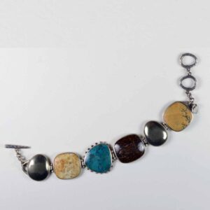 A bracelet with different colored stones and metal.