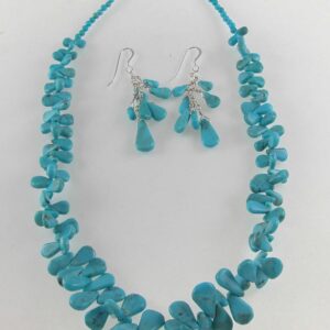 A necklace and earrings set made of turquoise.