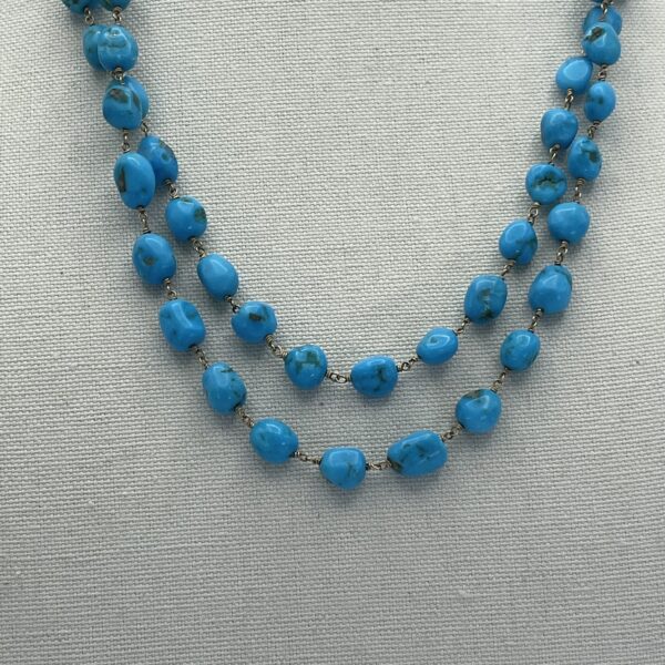 A necklace with blue beads on it