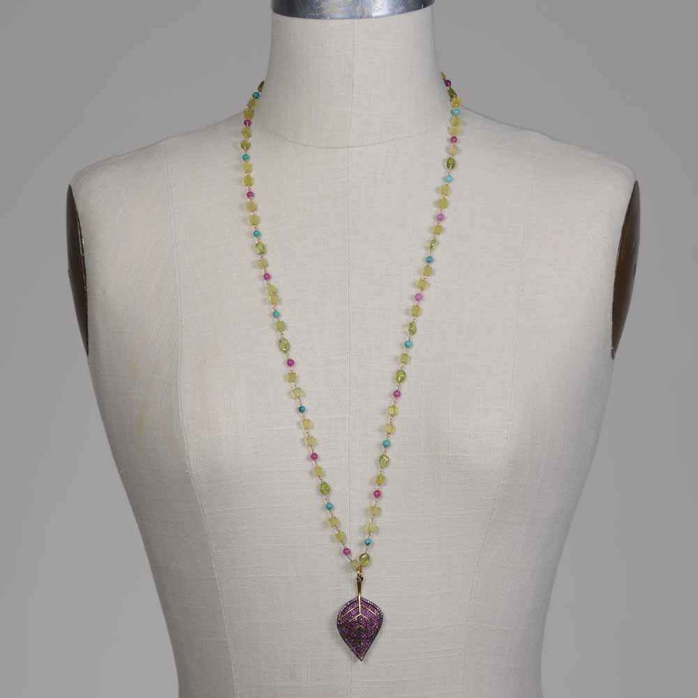 A necklace is shown on the mannequin.