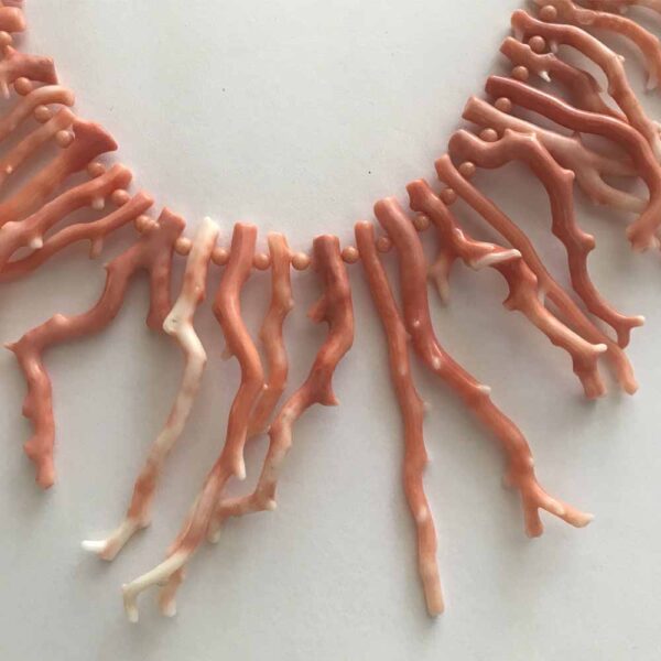 A close up of a necklace made out of food