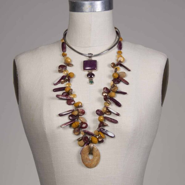 A necklace and earrings set on display.