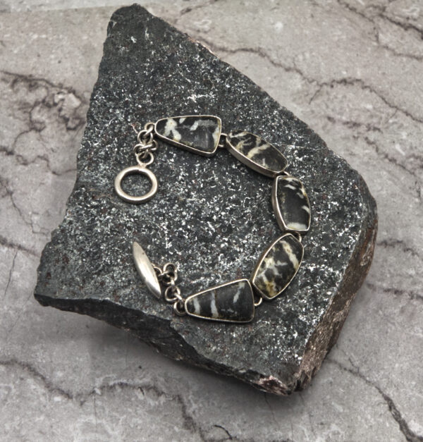 A stone with a metal chain on it